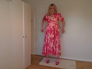 Stripping out of a long red dress