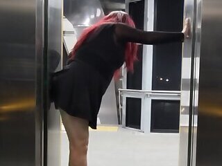 Shemale fucks a BBC dildo in public train station