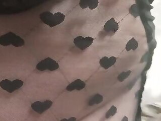 I'm wearing a wide mini with hearts, red transparent stockings and my stiletto heels and I feel