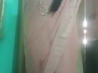 Indian trans woman Gaurisissy pressing and milking her boobs in pink saree