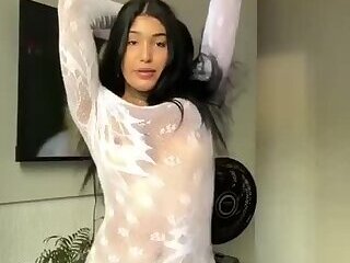 Sexy latina Trans loves stripping away her see through dress for her fans