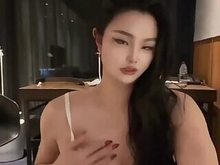 Chinese tranny in white silk lingerie gets fucked in the anus until she gets an orgasm