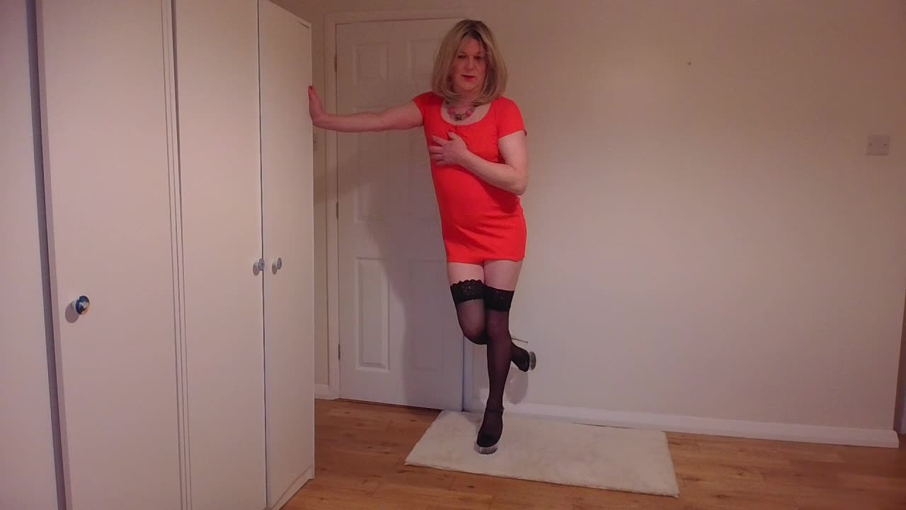 Taking off my red minidress in black stockings